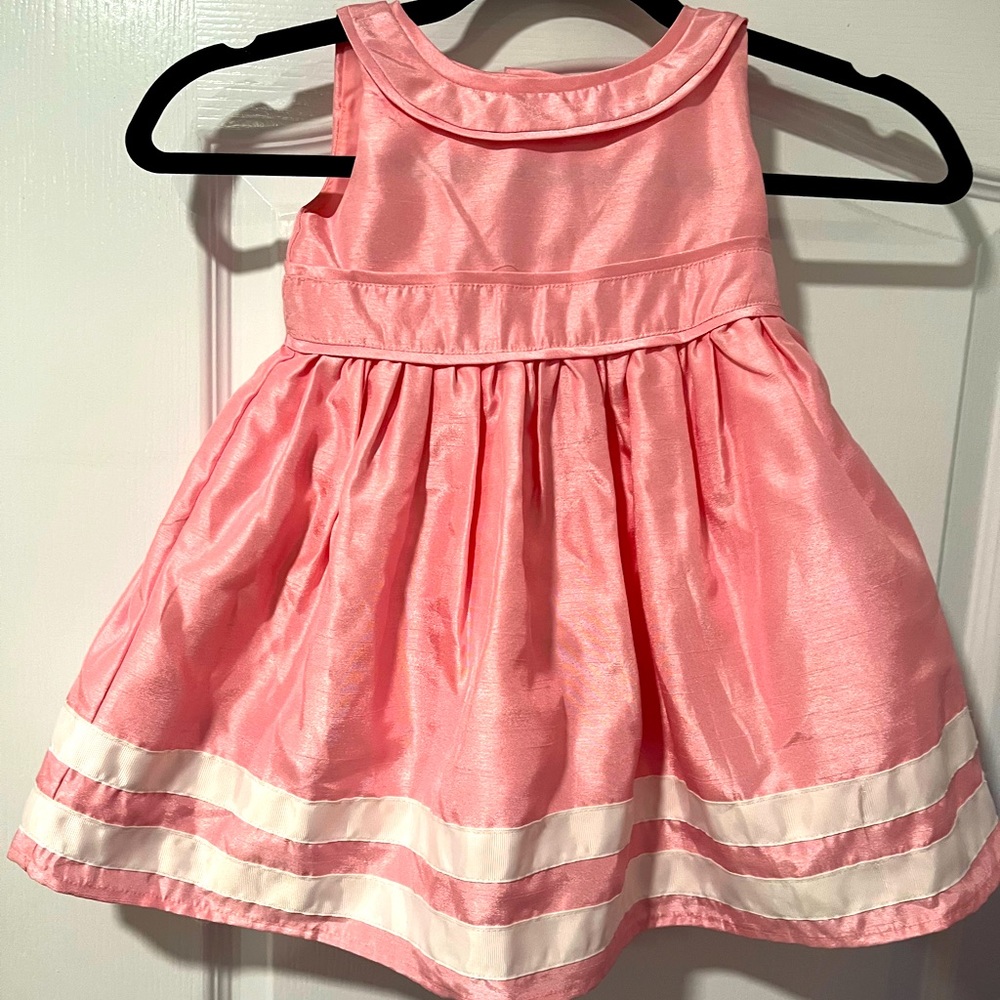Beautiful dress by Gymboree new with tags never worn …check out the back